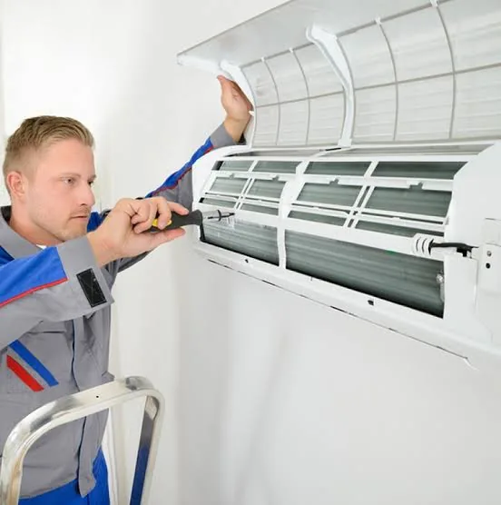 HVAC technician inspecting residential equipment in Lewiston NY